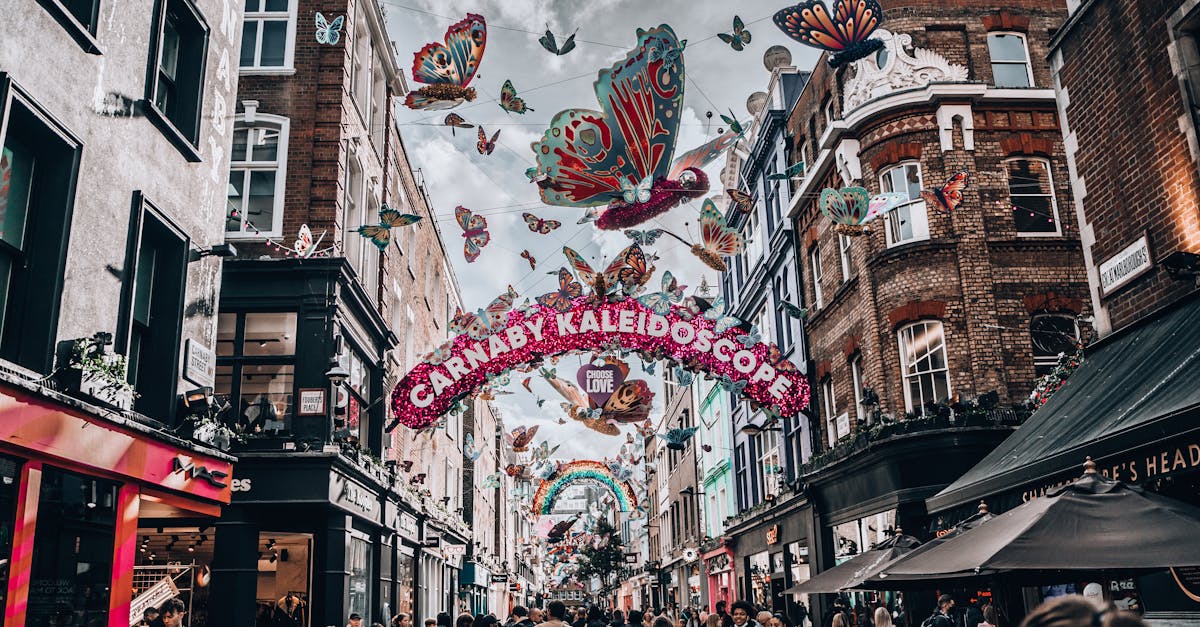 A bustling day at London's Carnaby Street with colorful decorations and lively atmosphere.