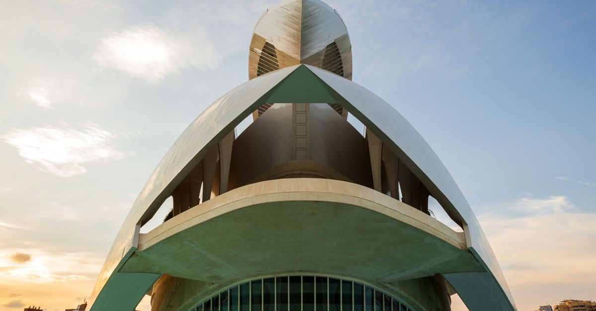 Futuristic building in Valencia's City of Arts and Sciences against a daytime sky.