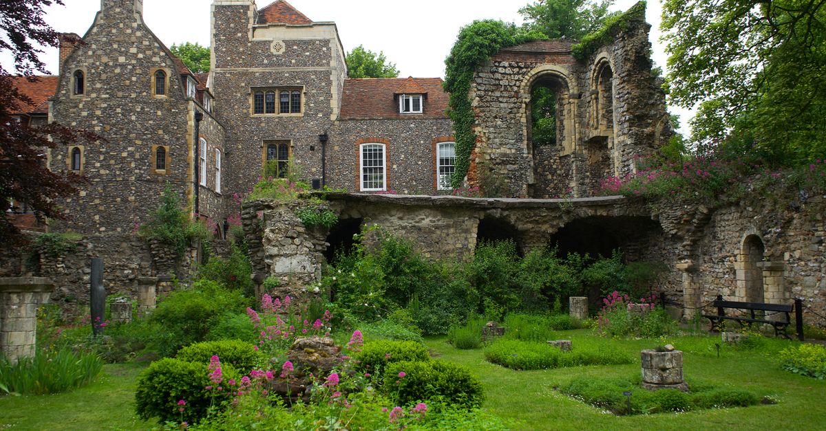 Medieval architecture with garden view in Canterbury, England.