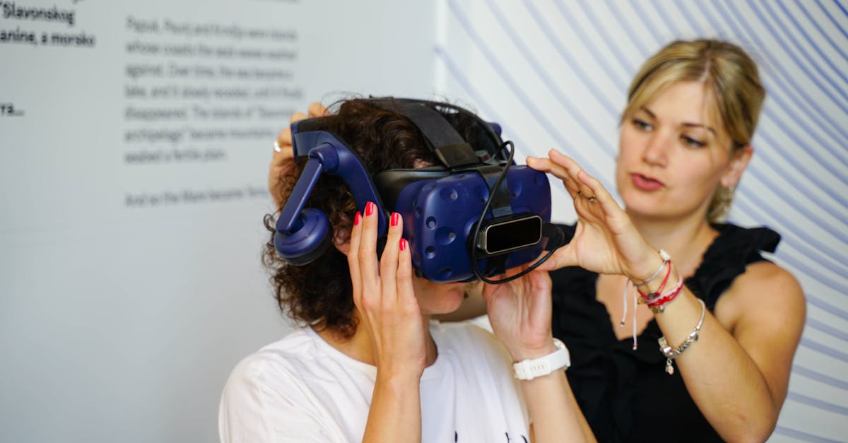 Two women exploring virtual reality indoors with a VR headset.