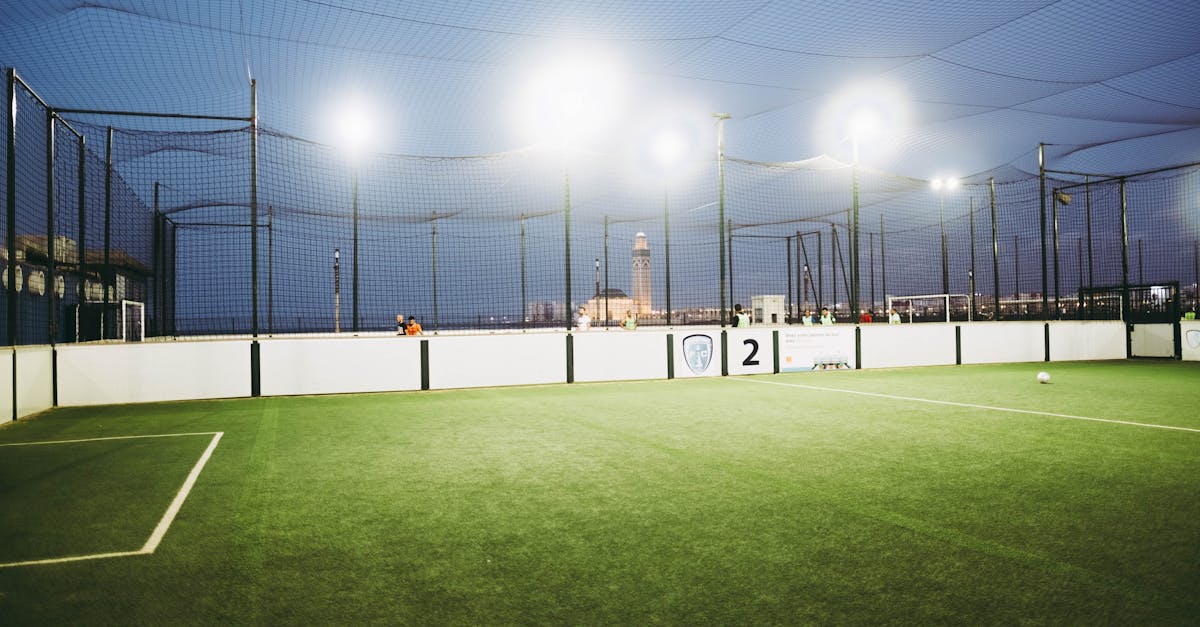 Illuminated soccer field with Hassan II Mosque in the background, Casablanca.