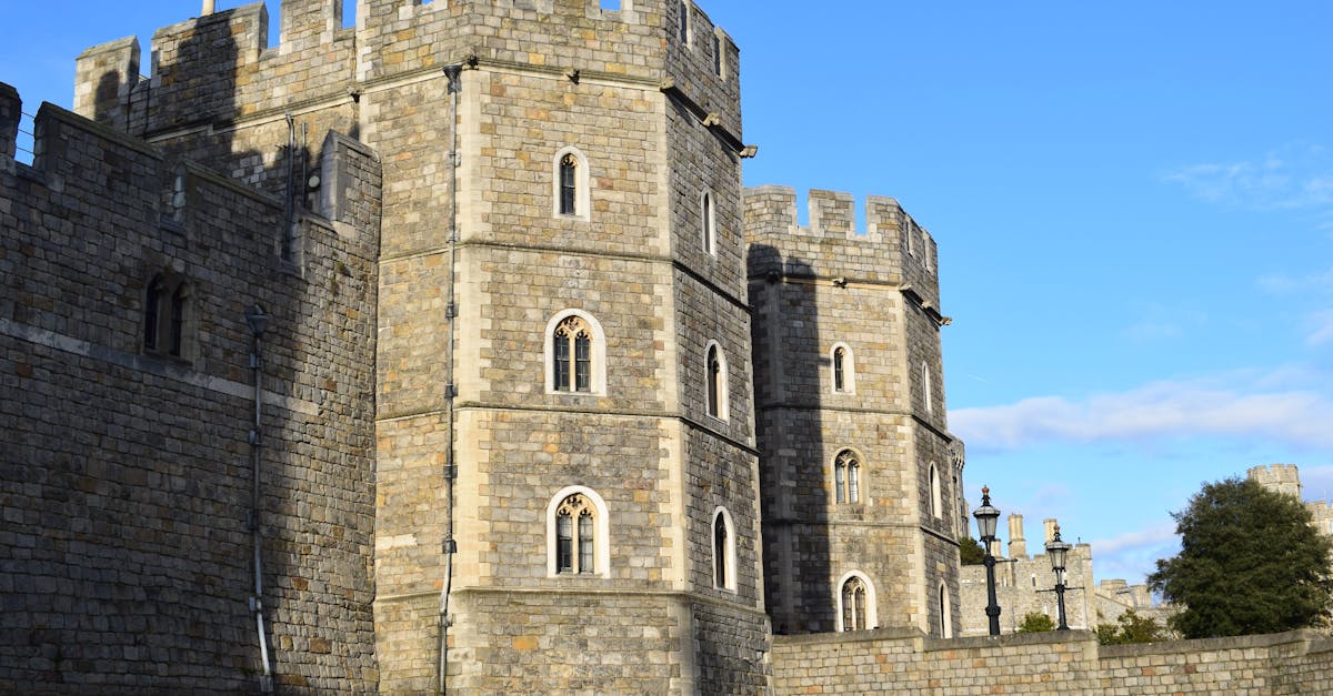 Capture the historic stone architecture of Windsor Castle on a sunny day, highlighting its medieval fortification.