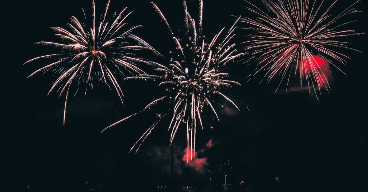 Vibrant fireworks illuminating the night sky with colorful bursts.