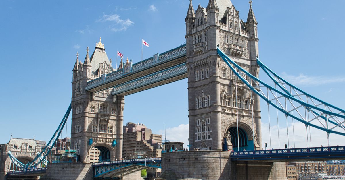 Iconic Tower Bridge in London, England, captured under a clear blue sky, showcasing its historic architecture.