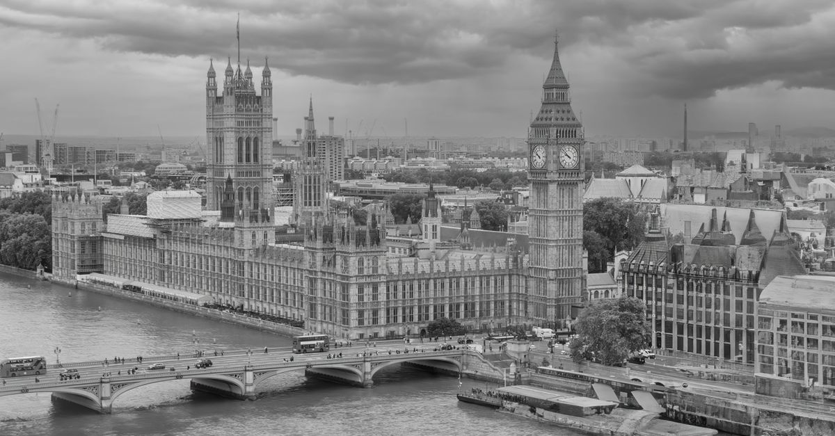 Monochrome aerial view of Big Ben and the Houses of Parliament over the River Thames in London.