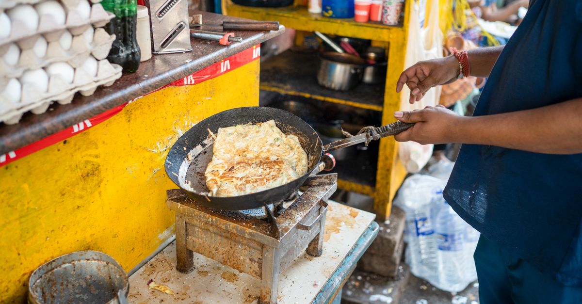 Man Hands Holding Pan and Cooking