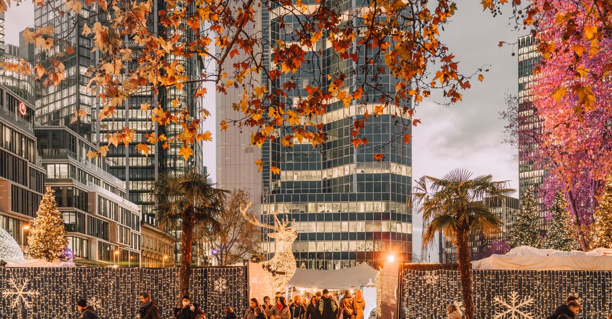 Experience the lively Christmas market in Frankfurt with illuminated skyscrapers, festive decorations, and urban atmosphere.