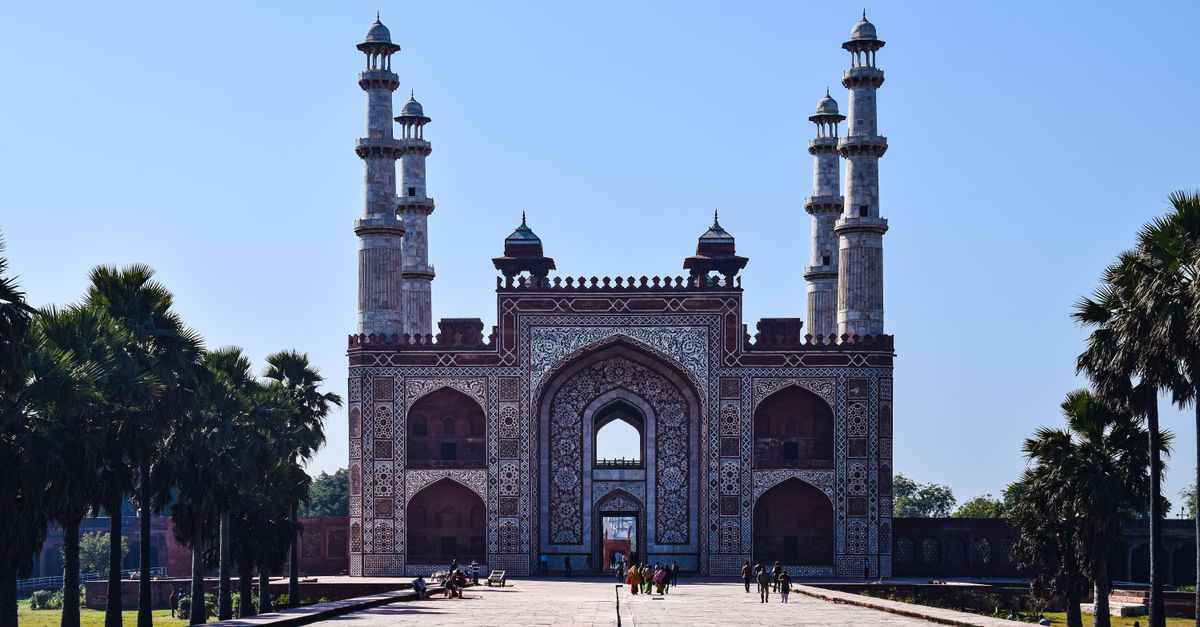 Stunning architectural view of Akbar's Tomb entrance in Agra, India showcasing Mughal design.