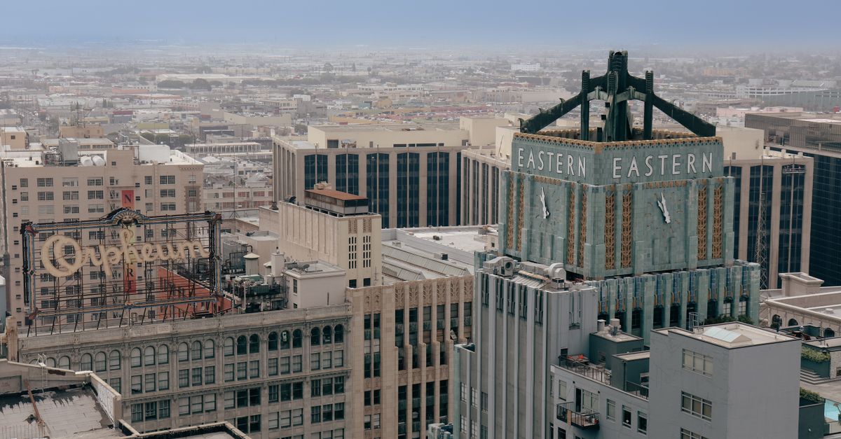 Aerial view of the iconic Eastern Columbia Building and surrounding cityscape in downtown Los Angeles.