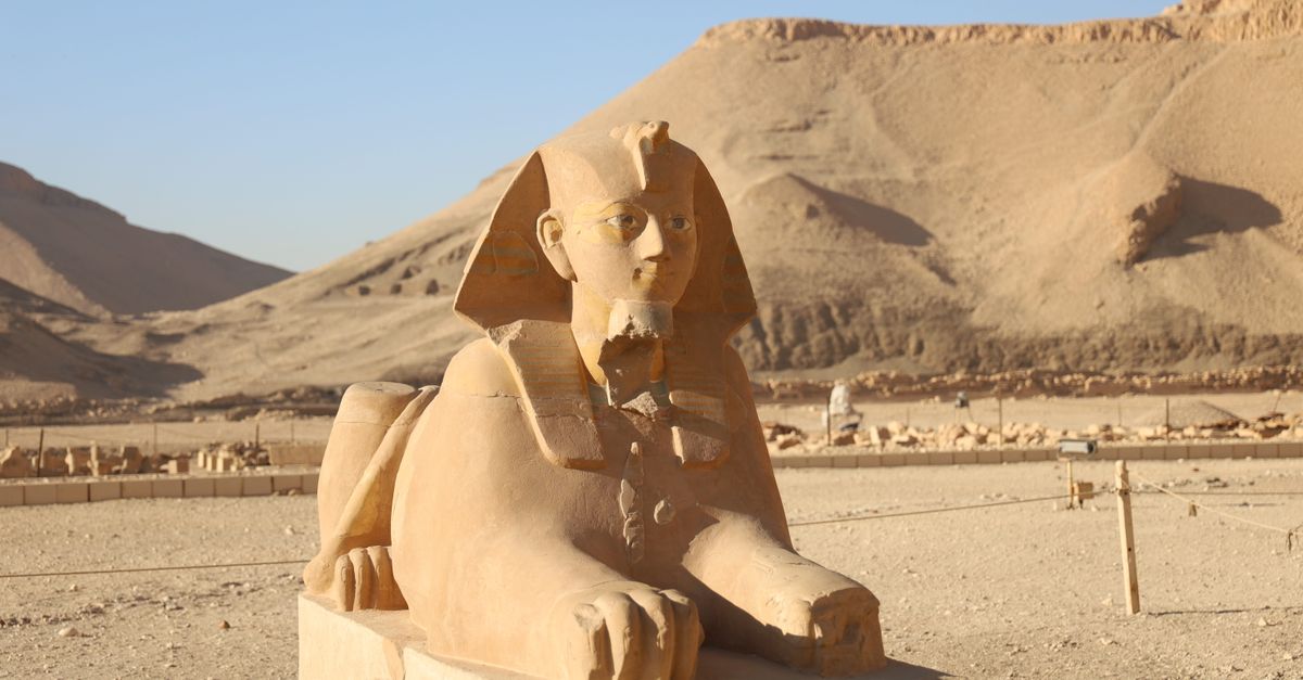 A limestone sphinx statue in the Temple of Hatshepsut, showcasing ancient Egyptian art and architecture.