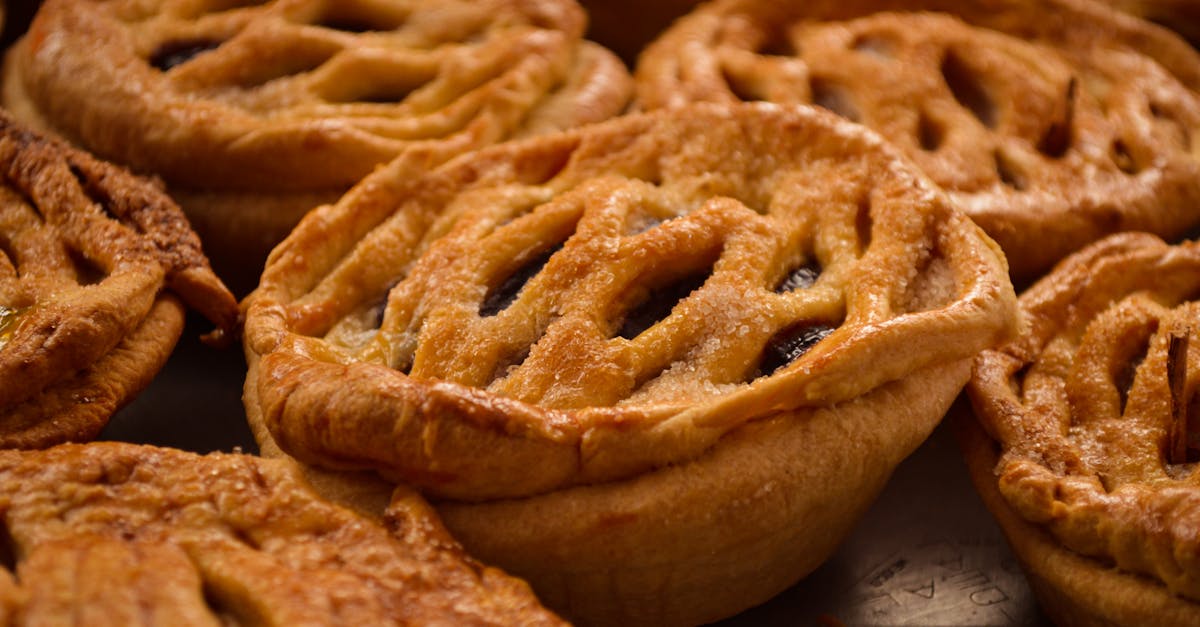 Golden brown apple pies with lattice crusts, capturing the essence of traditional Mexican bakery treats.