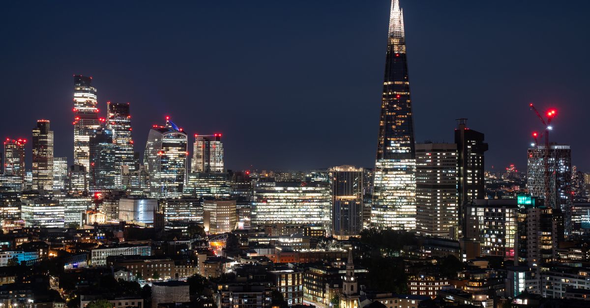 A vibrant night view of London's skyline with The Shard and city lights.