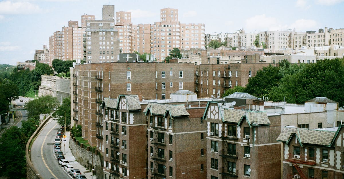 A summer view of urban residential buildings showcasing classic architecture.