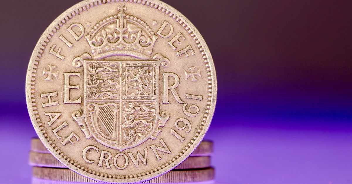 Detailed image of a 1961 British half crown coin, showing intricate design and historical elements.