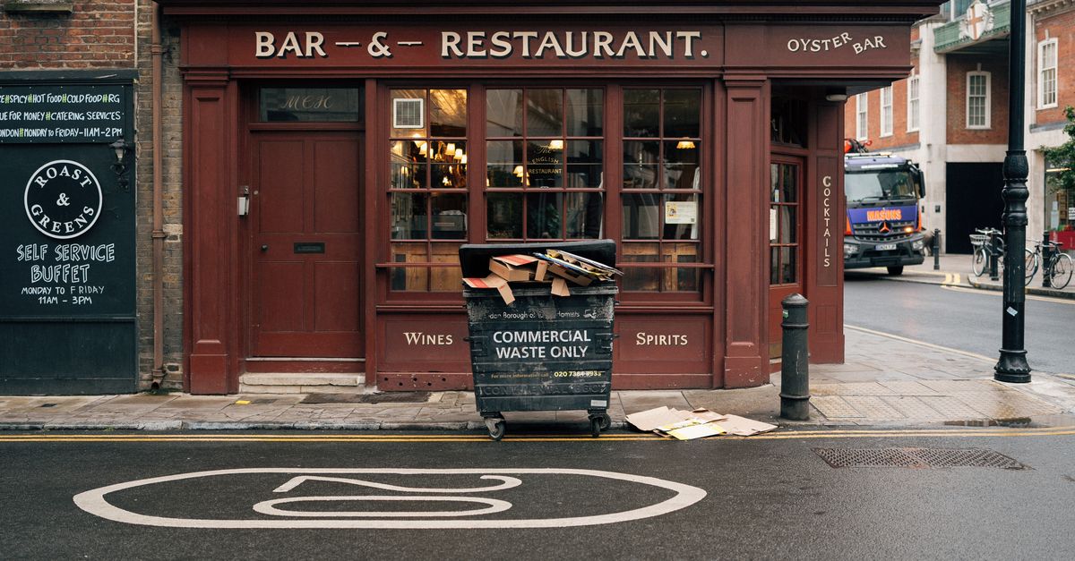 Charming London street view featuring a classic bar and restaurant facade on Crispin Street.