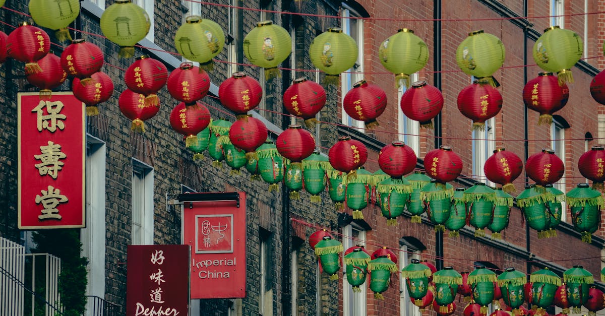 Colorful Chinese lanterns decorating a street in London's Chinatown, creating a festive atmosphere.
