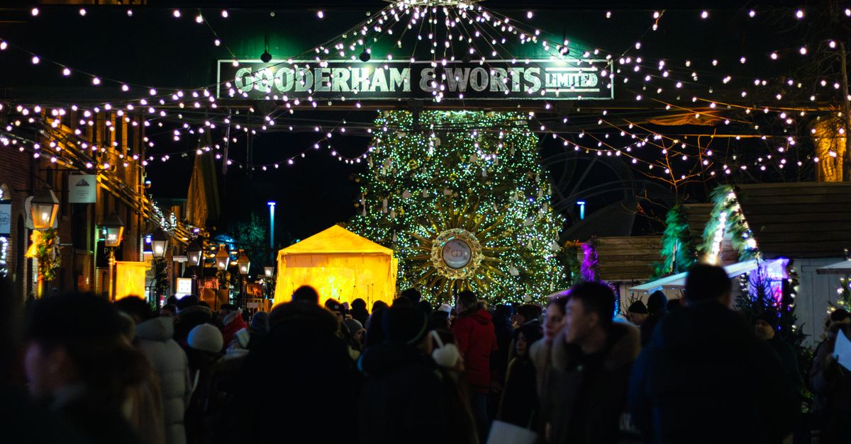 Christmas market bustle in Toronto with lights and festive decorations.