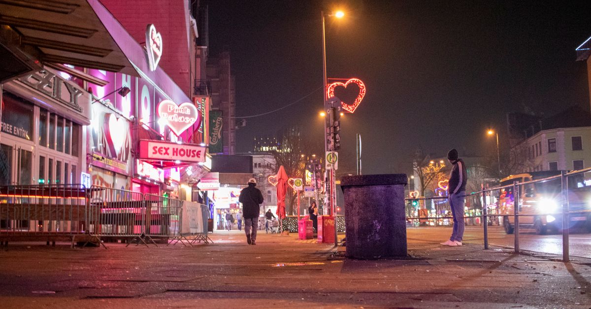 Explore the vibrant nightlife in Hamburg's famous Reeperbahn district, featuring neon lights and lively streets.