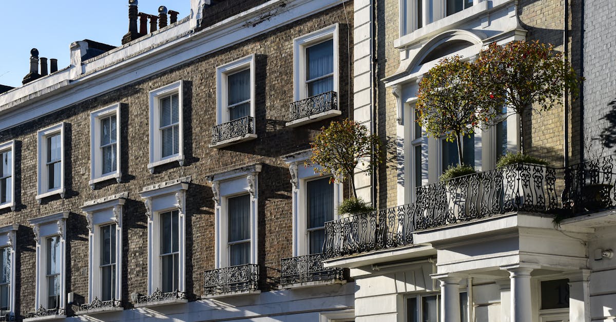 Elegant London townhouses with ornate balconies and lush greenery.