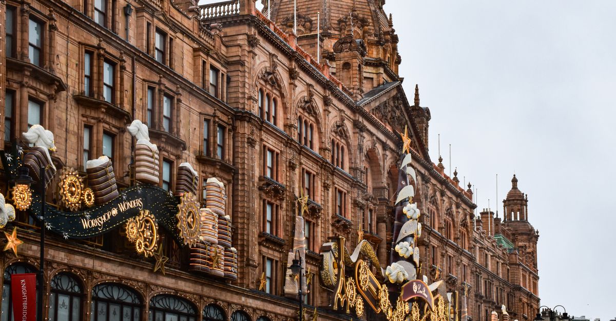 The iconic facade of Harrods in Knightsbridge adorned with festive decorations and a holiday theme.