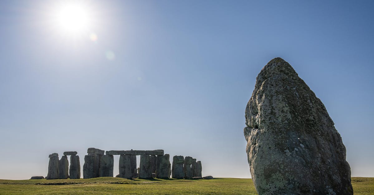 Stonehenge landscape captured under the bright midday sun on a clear day.