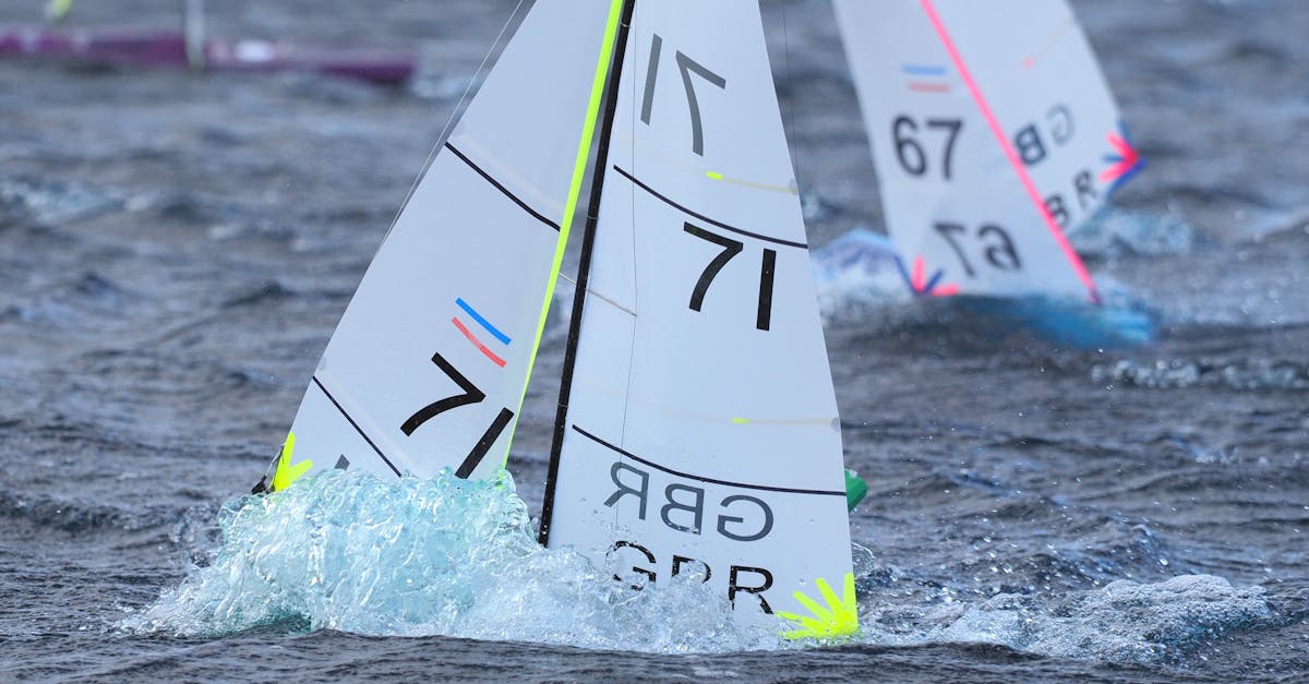 Close-up of model sailboats with GBR number 71 racing on water in Lincoln, England.