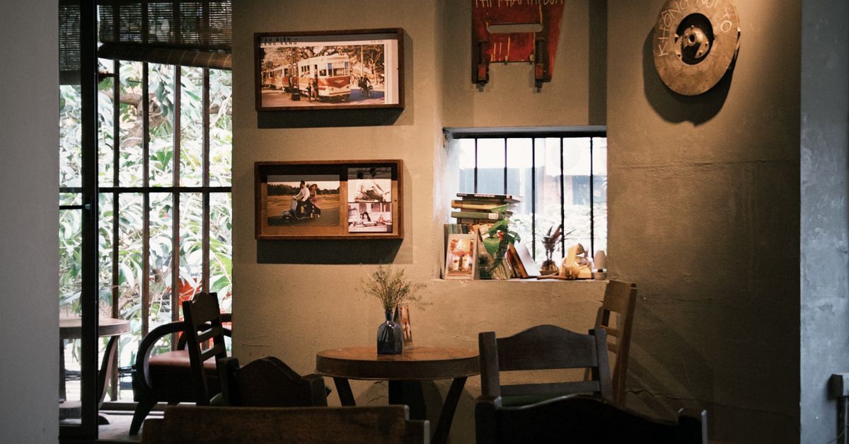 Warm and inviting interior of a rustic cafe featuring vintage decor, perfect for relaxing.