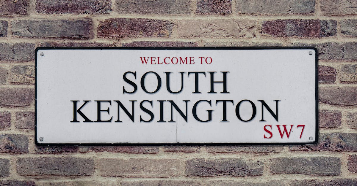Street sign for South Kensington, London, UK, showcasing local charm.