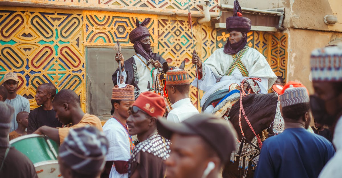 Vibrant street festival in Africa showcasing traditional attire and architecture.