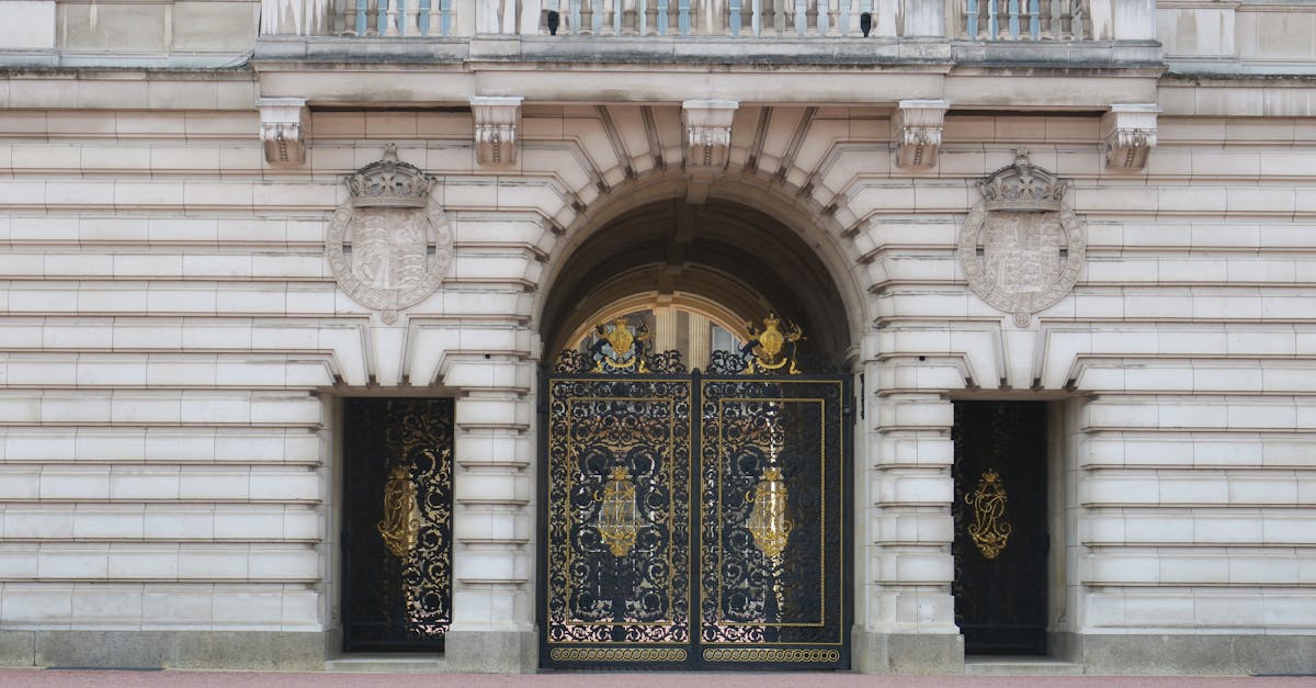 Ornate gates and architecture of Buckingham Palace in London.