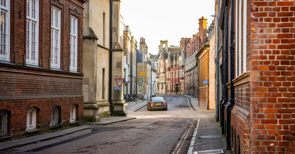 Charming street in Cambridge with historic architecture and cobblestone road.