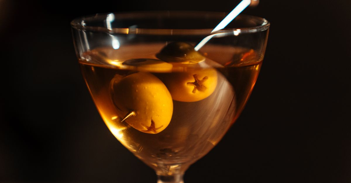 A close-up of a classic martini with olives, beautifully presented in a Tokyo cocktail bar.