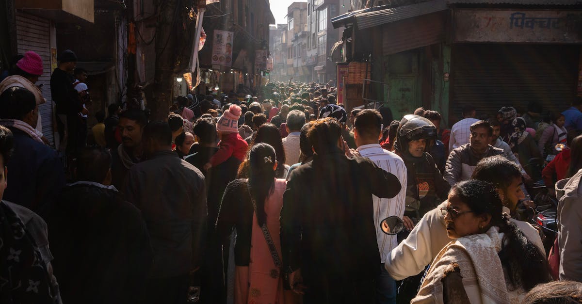 A bustling street market in India with a diverse crowd and vibrant atmosphere.