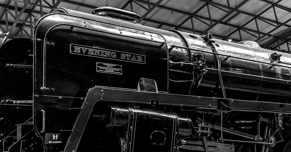 Black and white photo of the Evening Star steam locomotive displayed indoors.
