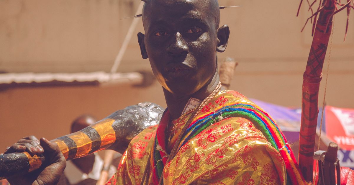 A vibrant portrait of a person in traditional festival attire, showcasing rich cultural heritage.