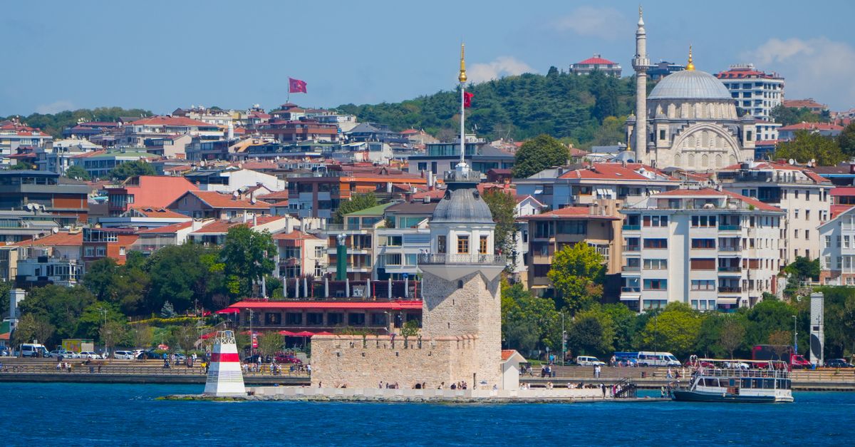 Beautiful view of the Maiden's Tower with Istanbul cityscape in the background.