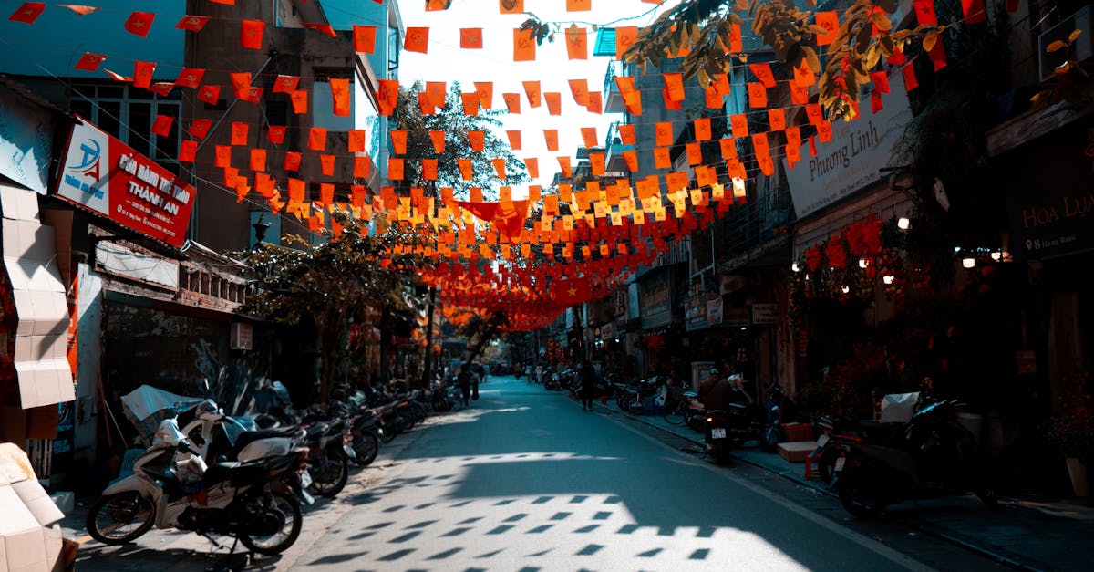 Vibrant bunting decorates a street in Hanoi, capturing the lively spirit of Vietnamese street life.