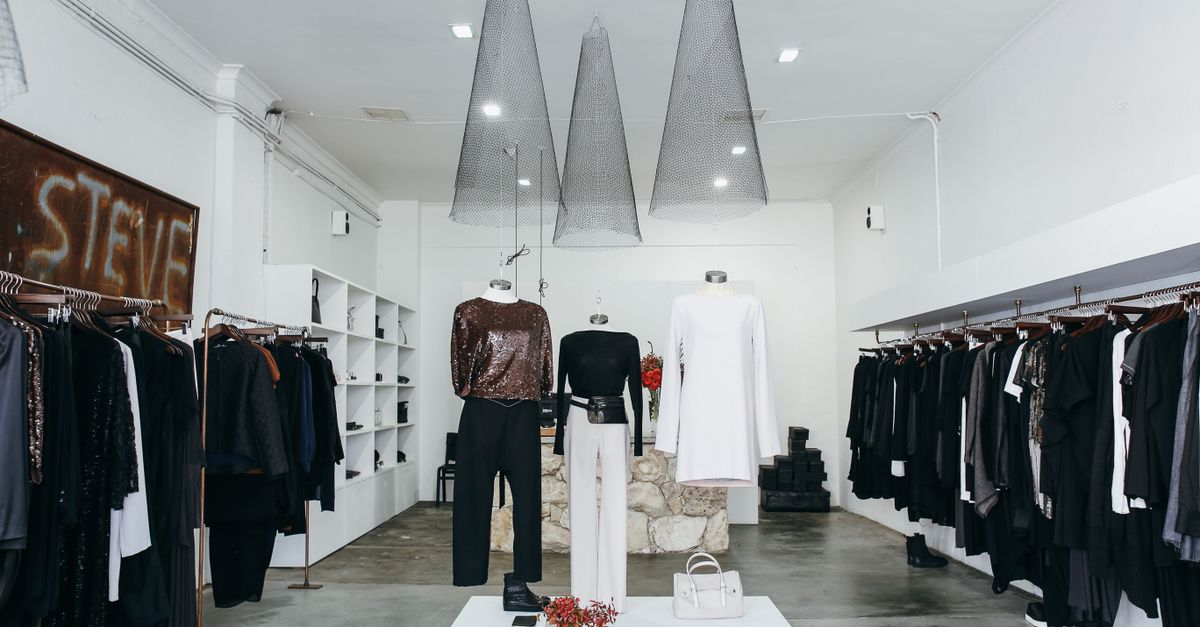 Chic boutique with elegant clothing display and stylish interior design.