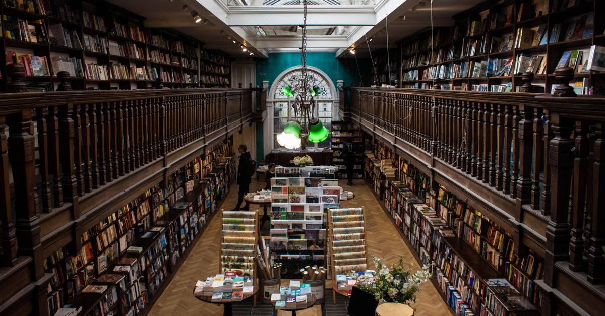 Explore the charm of a classic bookstore with stunning balconies and vast book collections.