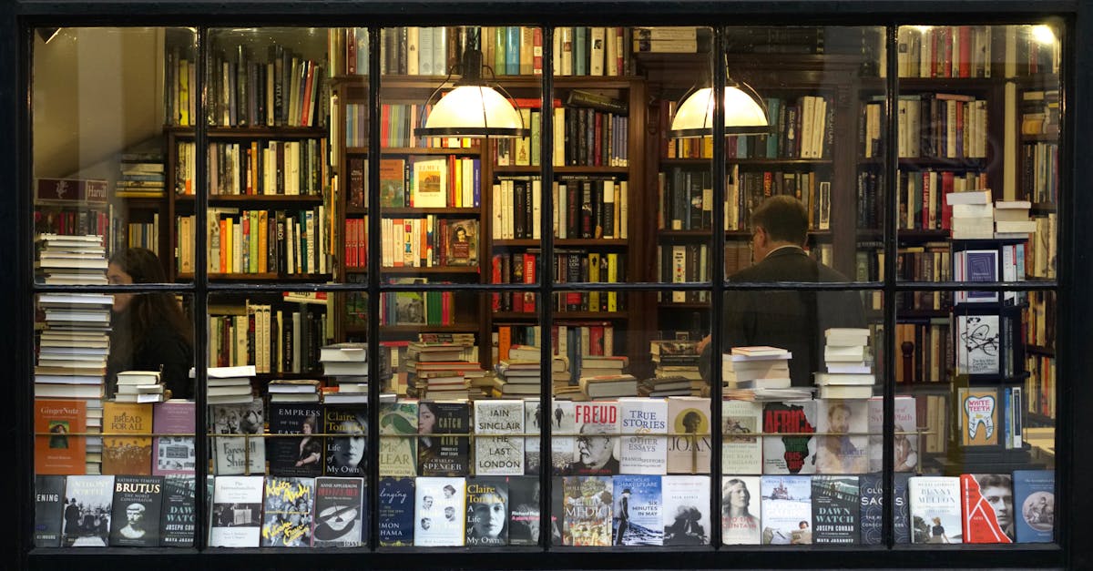 A cozy London bookstore showcasing various books through a classic window display.