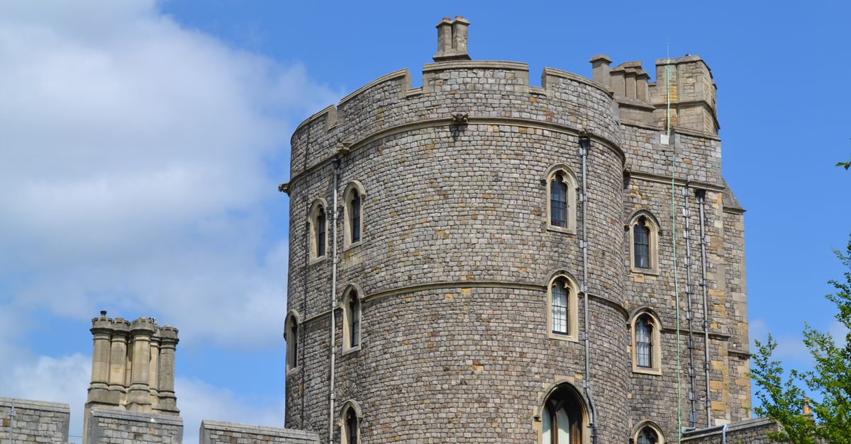 Close-up of a stone tower at Windsor Castle, capturing Gothic architecture in England.