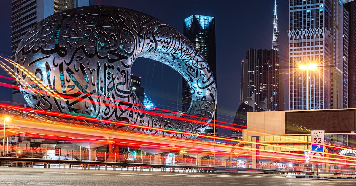 Long exposure of Dubai's Museum of the Future and skyline, showcasing architecture and light trails at night.