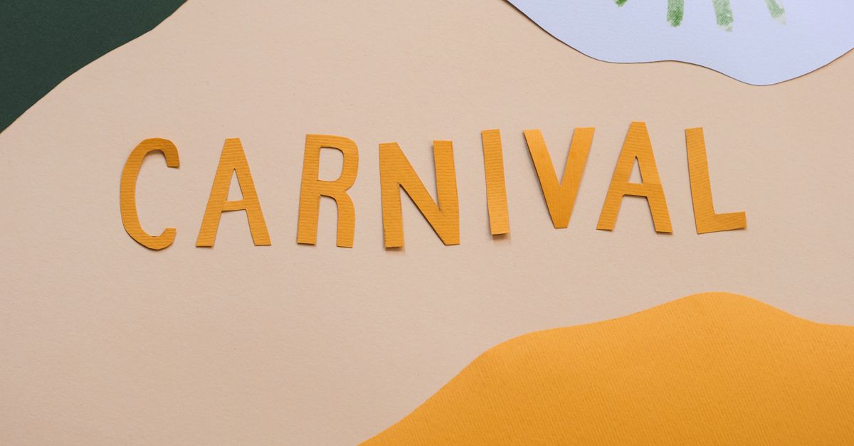 A vibrant carnival-themed decoration with cut-out paper letters on a pastel background.